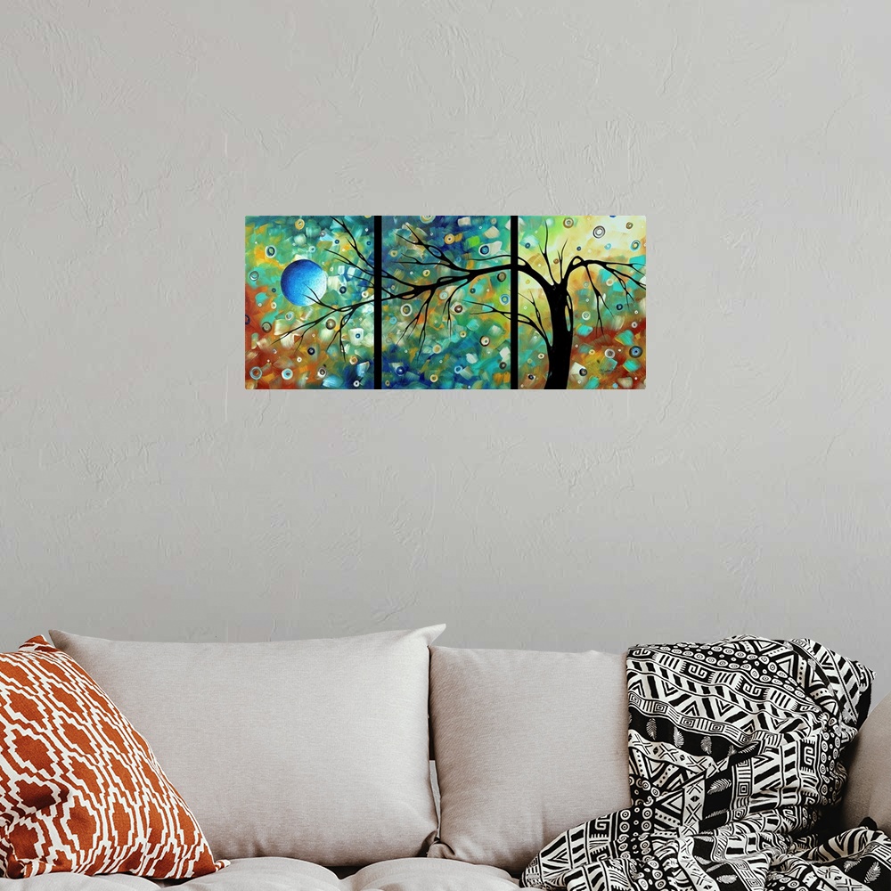 A bohemian room featuring Panoramic contemporary art focuses on a bare tree set against a background filled with bright and...