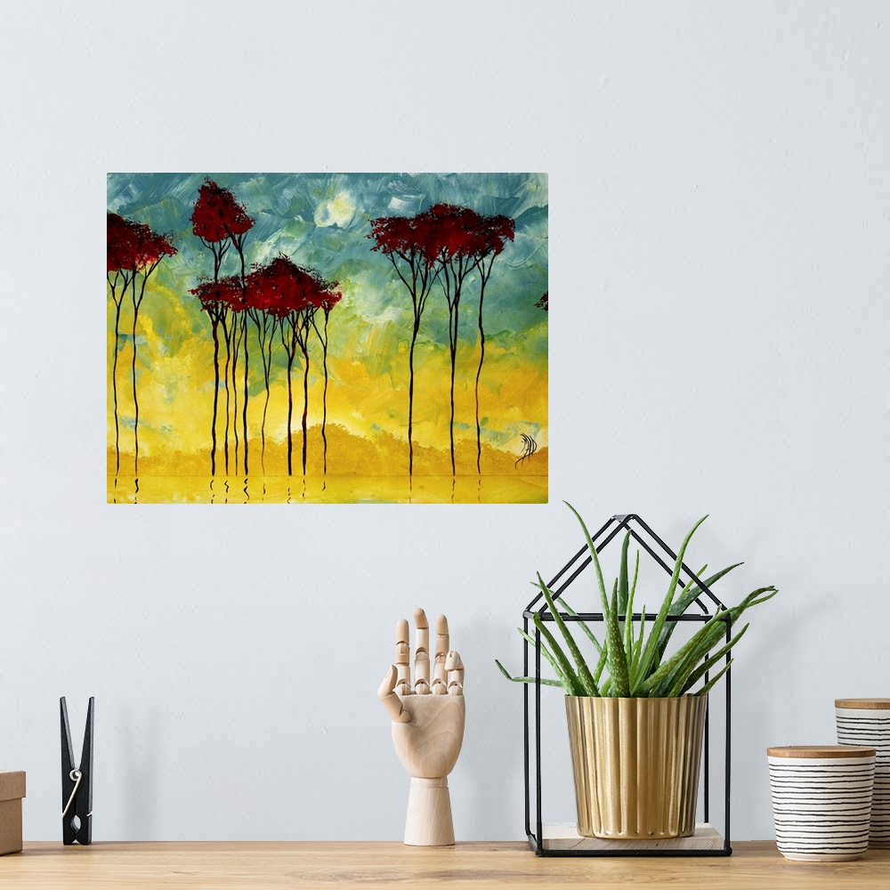 A bohemian room featuring Large painting of a row of trees reflecting off a pond. Mix of cool and vibrant tones.