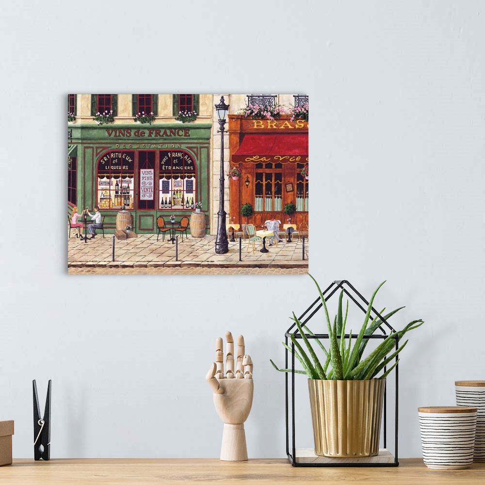 A bohemian room featuring Painting of a wine store and cafe in Paris.
