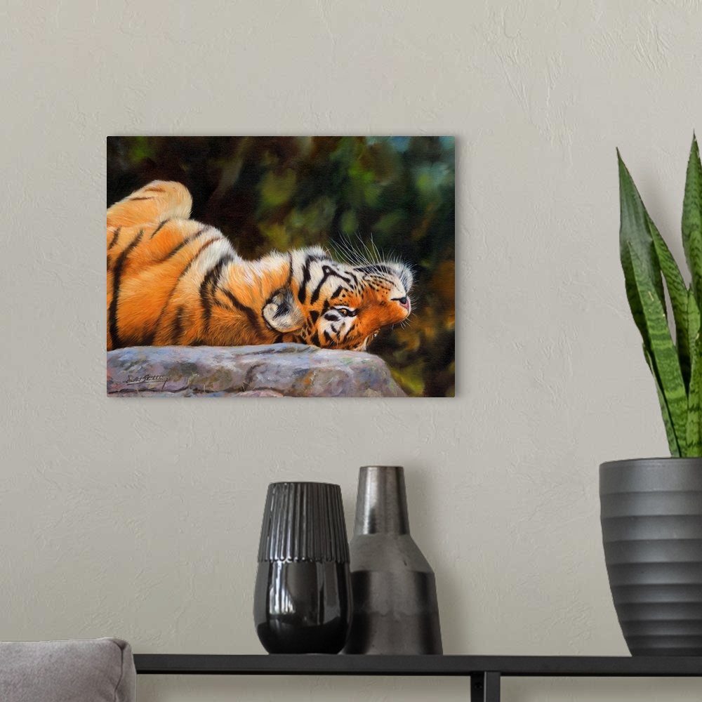 A modern room featuring Painting of a Siberian tiger playfully laying upside down on a rock.