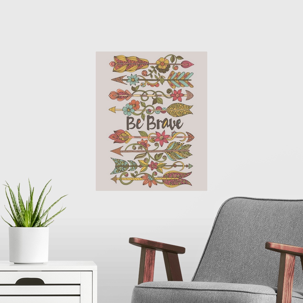 A modern room featuring "Be Brave" written in the center of intricately designed arrows decorated with flowers.