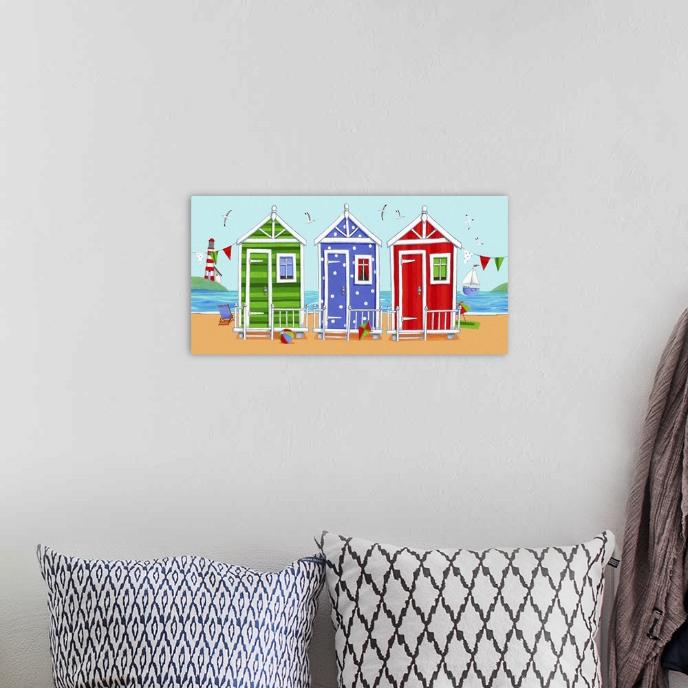 A bohemian room featuring Whimsical colorful beach art of three different colored beach huts, with the ocean in the backgro...