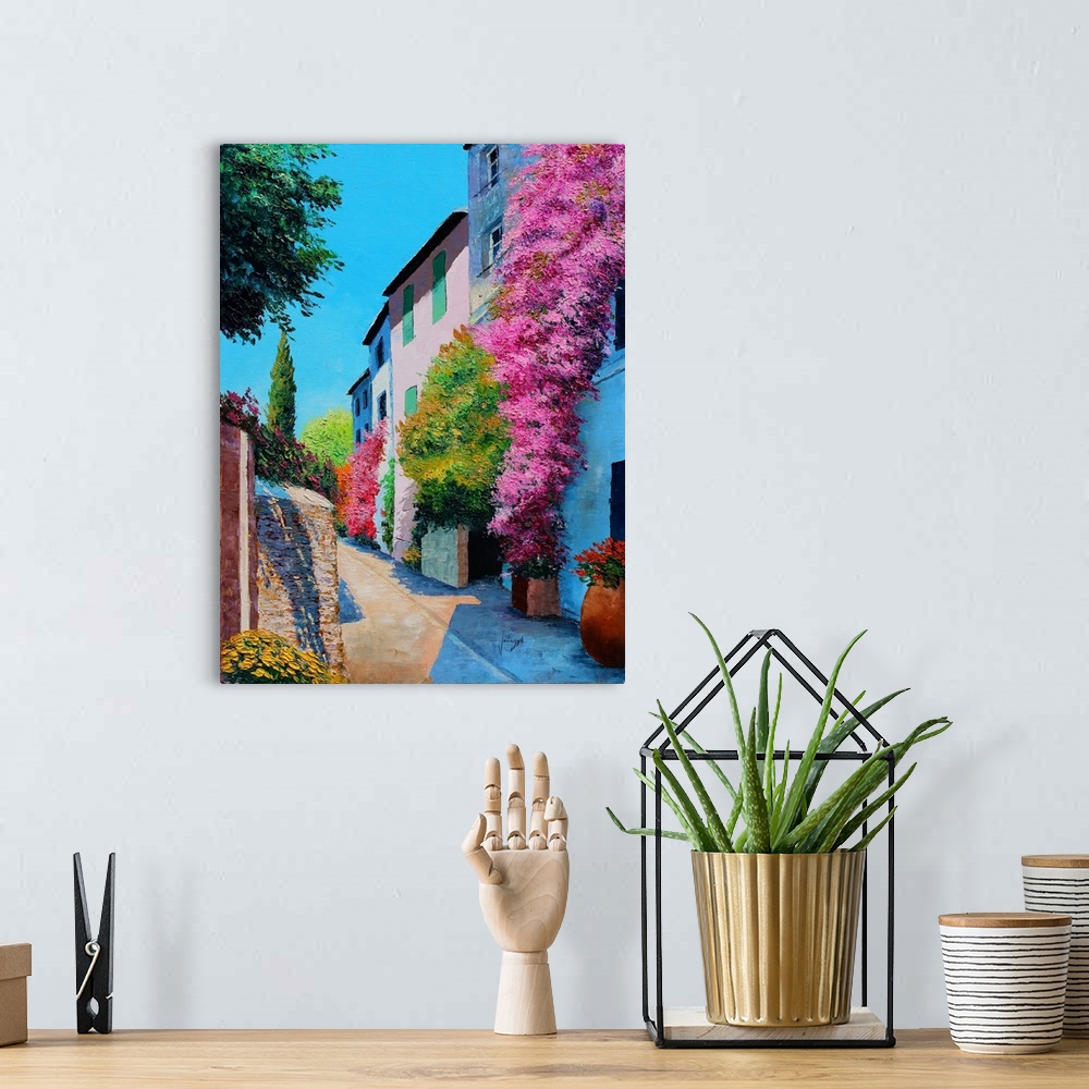 A bohemian room featuring Contemporary painting of a rural village covered in bright flowers.