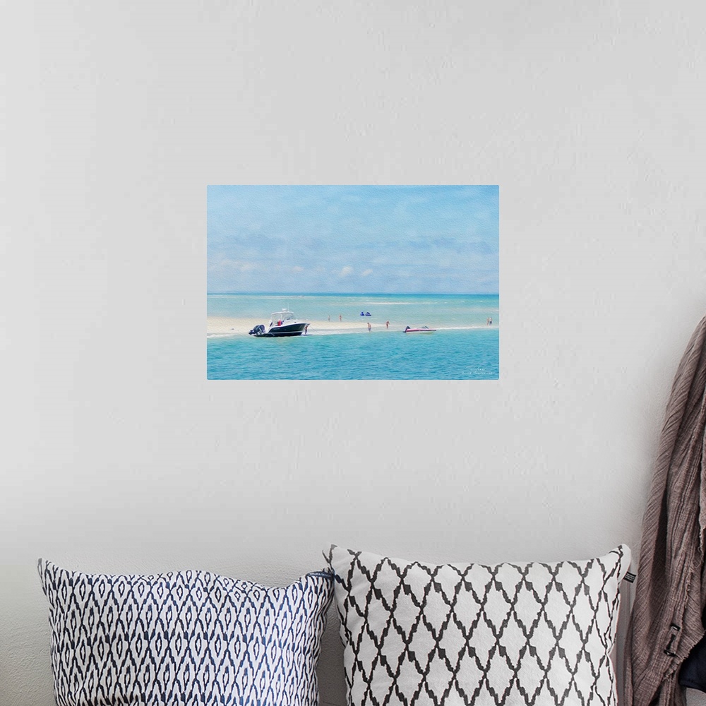 A bohemian room featuring A boat at the edge of a sandy beach with jet skis on the water.