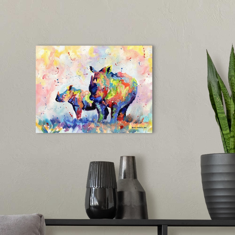 A modern room featuring Rhino and baby in rainbow colors painted in oil paints on canvas.
