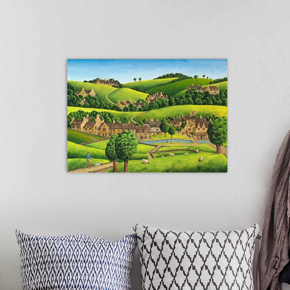 A bohemian room featuring Artwork of a small village nestled in the hills of England.