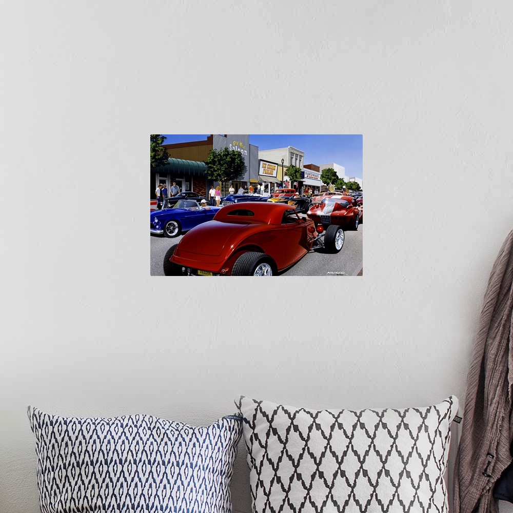 A bohemian room featuring Large photo print of the up close of a large group of hot rod cars driving up and down a small to...