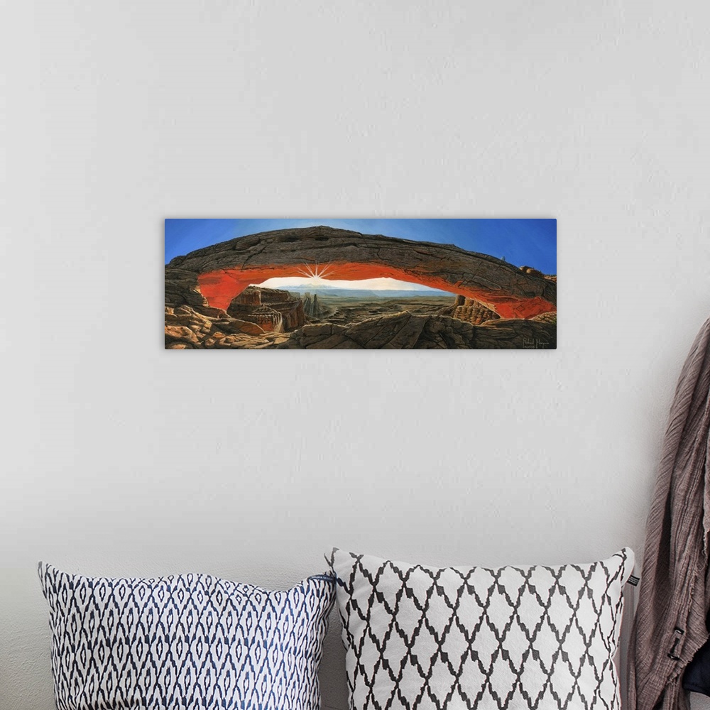 A bohemian room featuring Contemporary painting of a massive natural rock arch in a desert overlooking a vast rocky landscape.