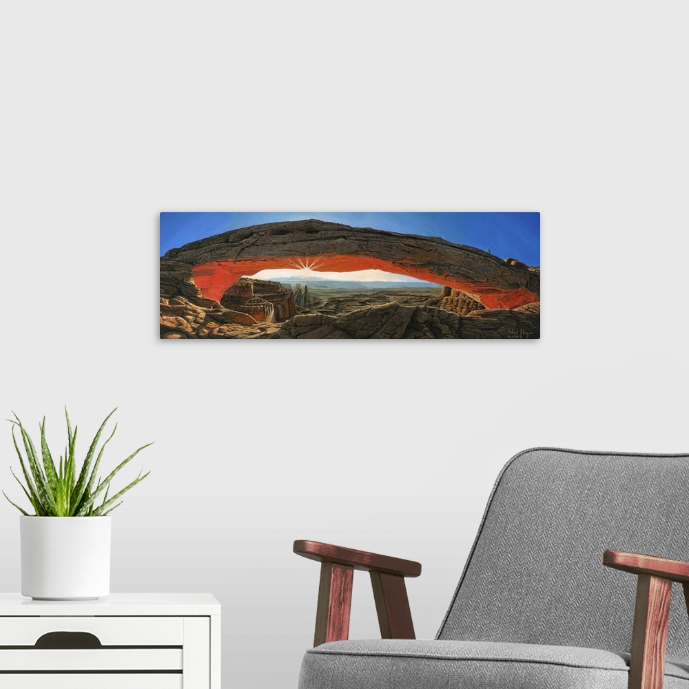 A modern room featuring Contemporary painting of a massive natural rock arch in a desert overlooking a vast rocky landscape.