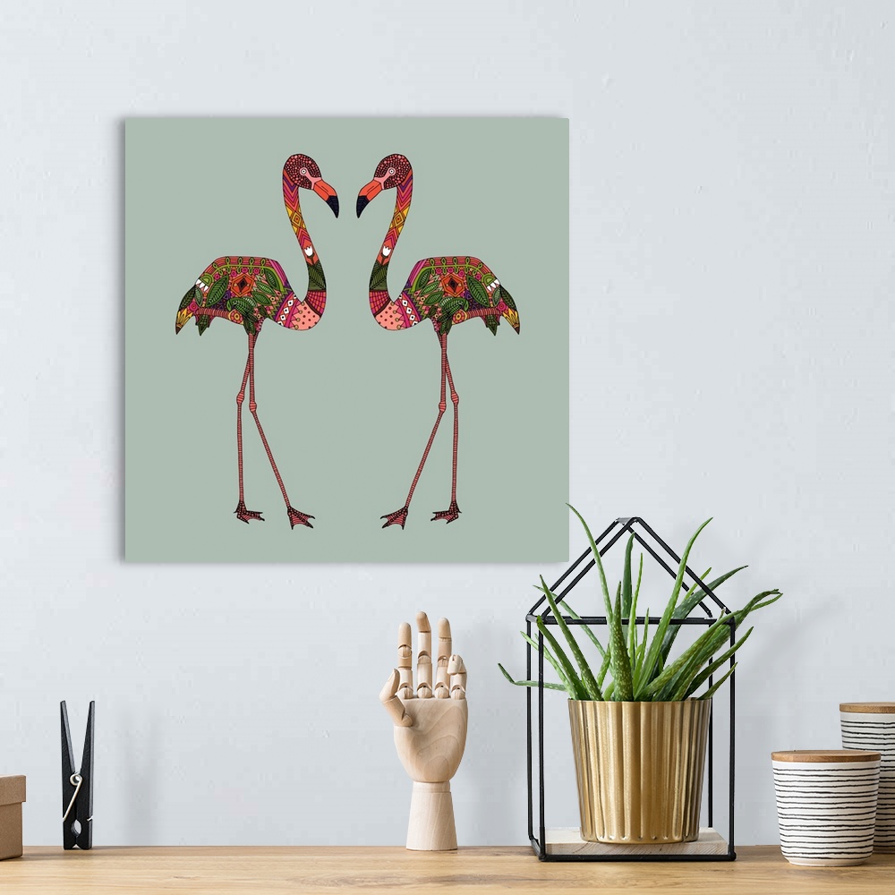 A bohemian room featuring A pair of pink flamingos with colorful patterns.