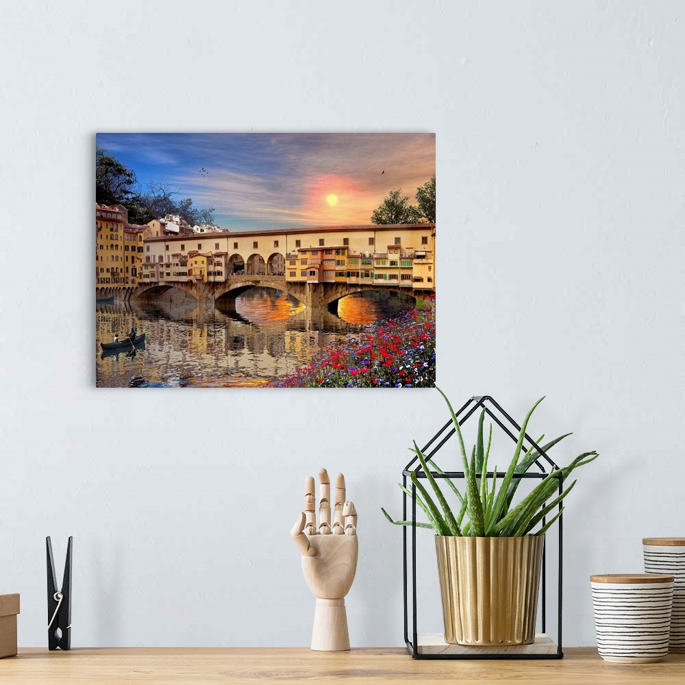 A bohemian room featuring A landscape picture of a bridge in Italy that is reflected in the water below with a canoe rowing...