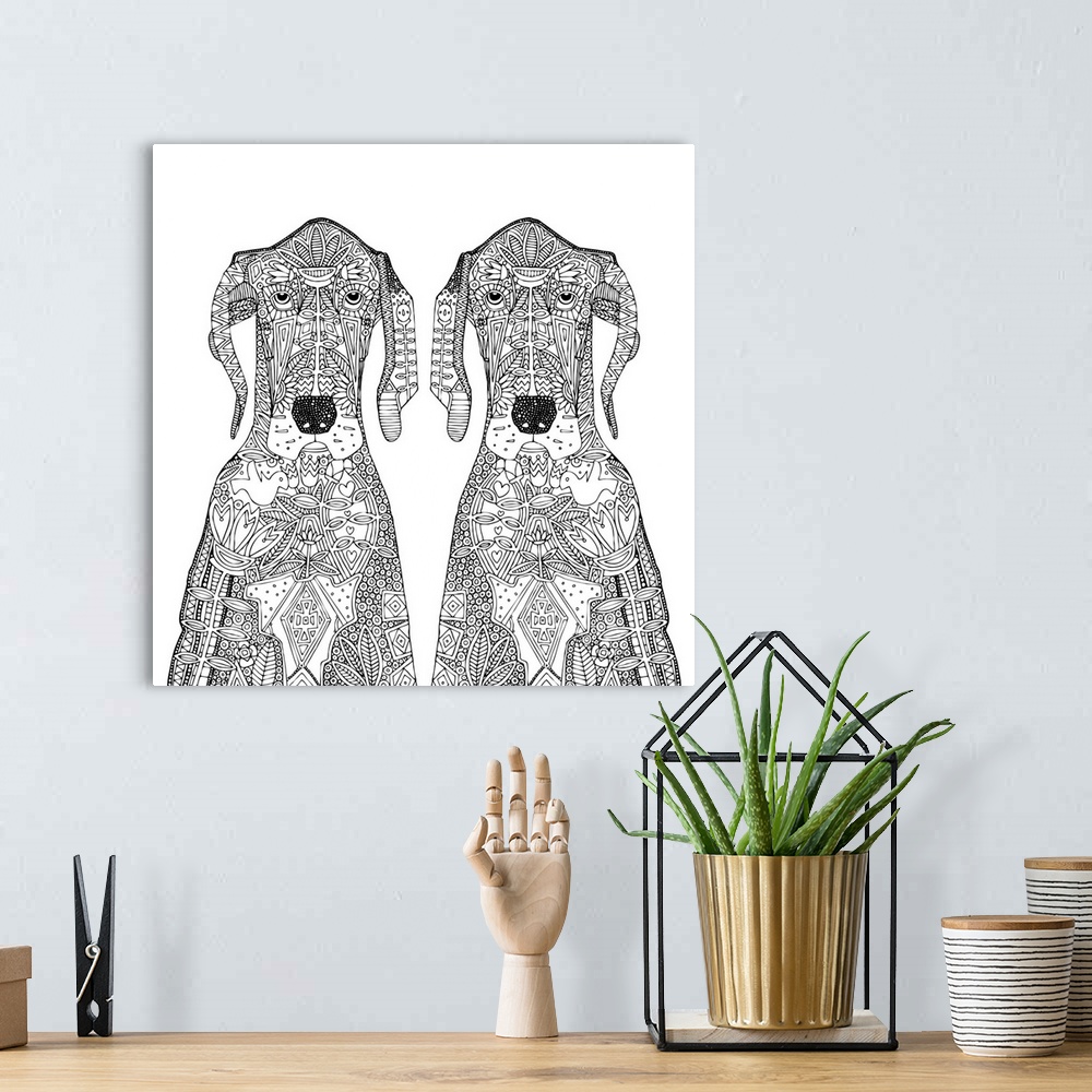 A bohemian room featuring Black and white line art of two identical great dane dogs with images in the line work.