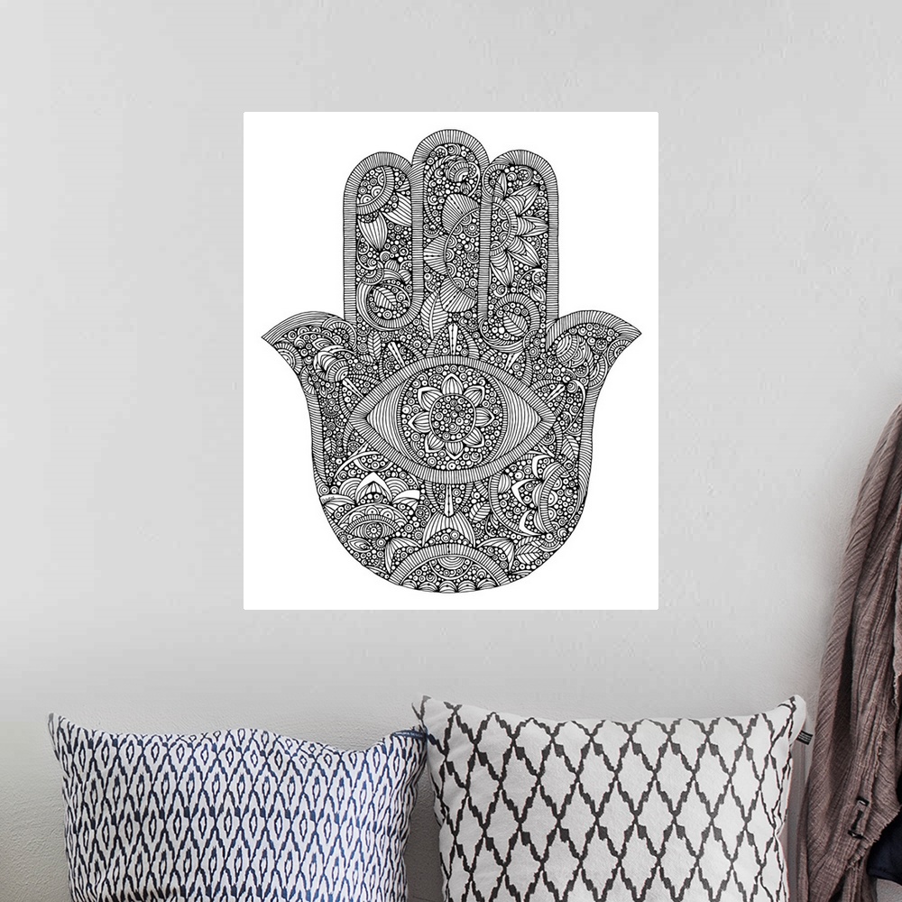 A bohemian room featuring Black and white line art of the Hamsa symbol against a white background.