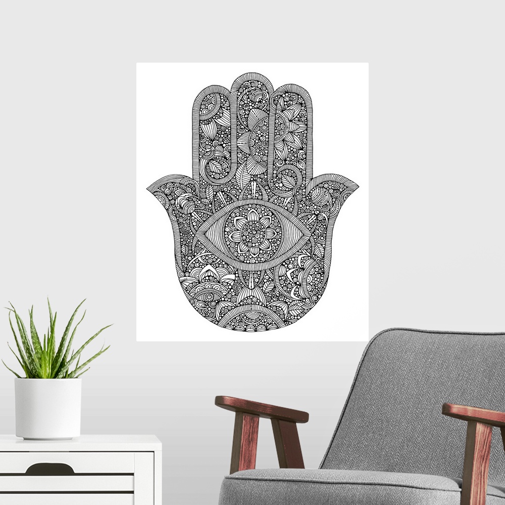 A modern room featuring Black and white line art of the Hamsa symbol against a white background.