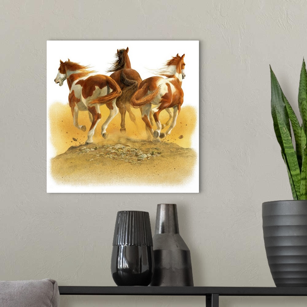 A modern room featuring Contemporary painting of three horse in a gallop kicking up dust and dirt.
