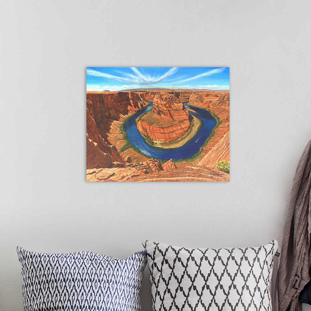 A bohemian room featuring Contemporary artwork of a large river running through a desert canyon.