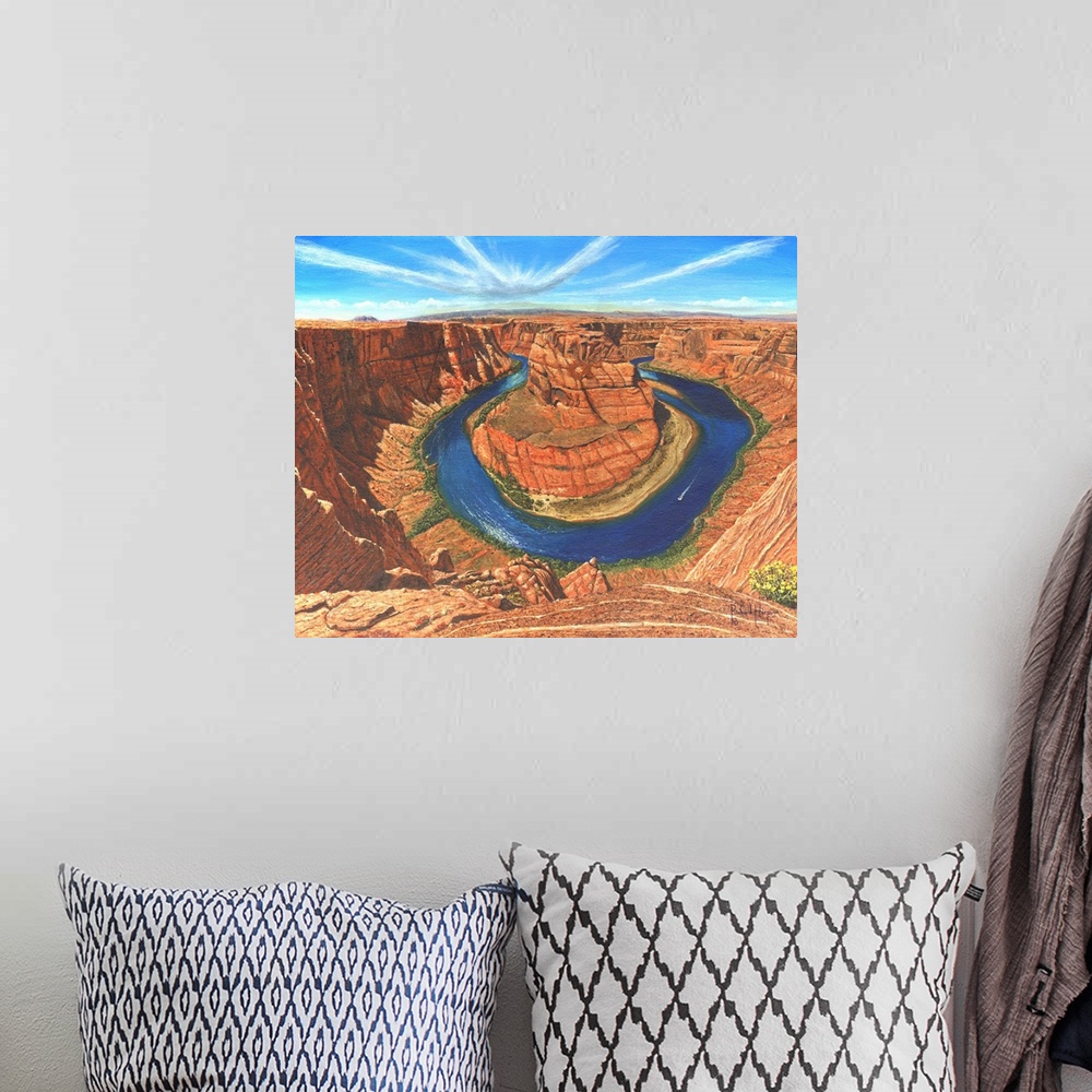 A bohemian room featuring Contemporary artwork of a large river running through a desert canyon.