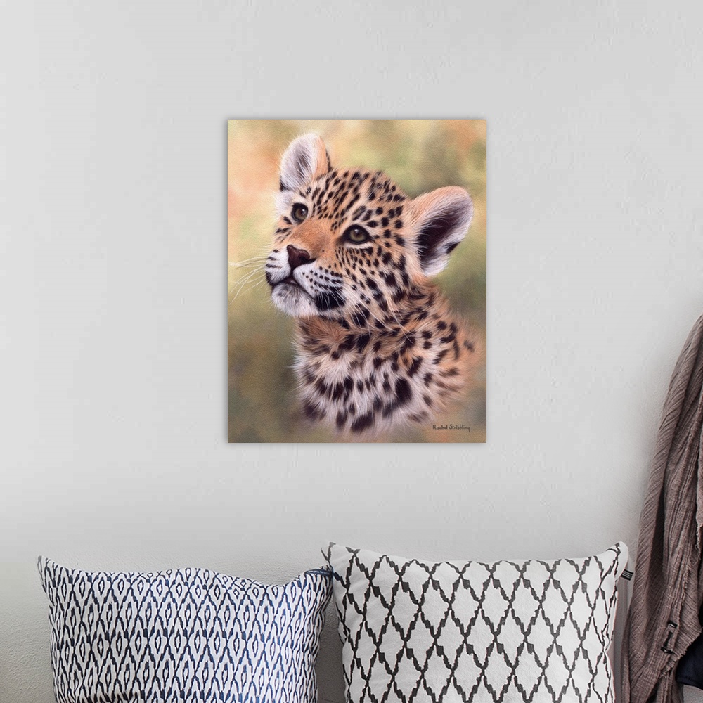 A bohemian room featuring Portrait of a jaguar cub looking up.