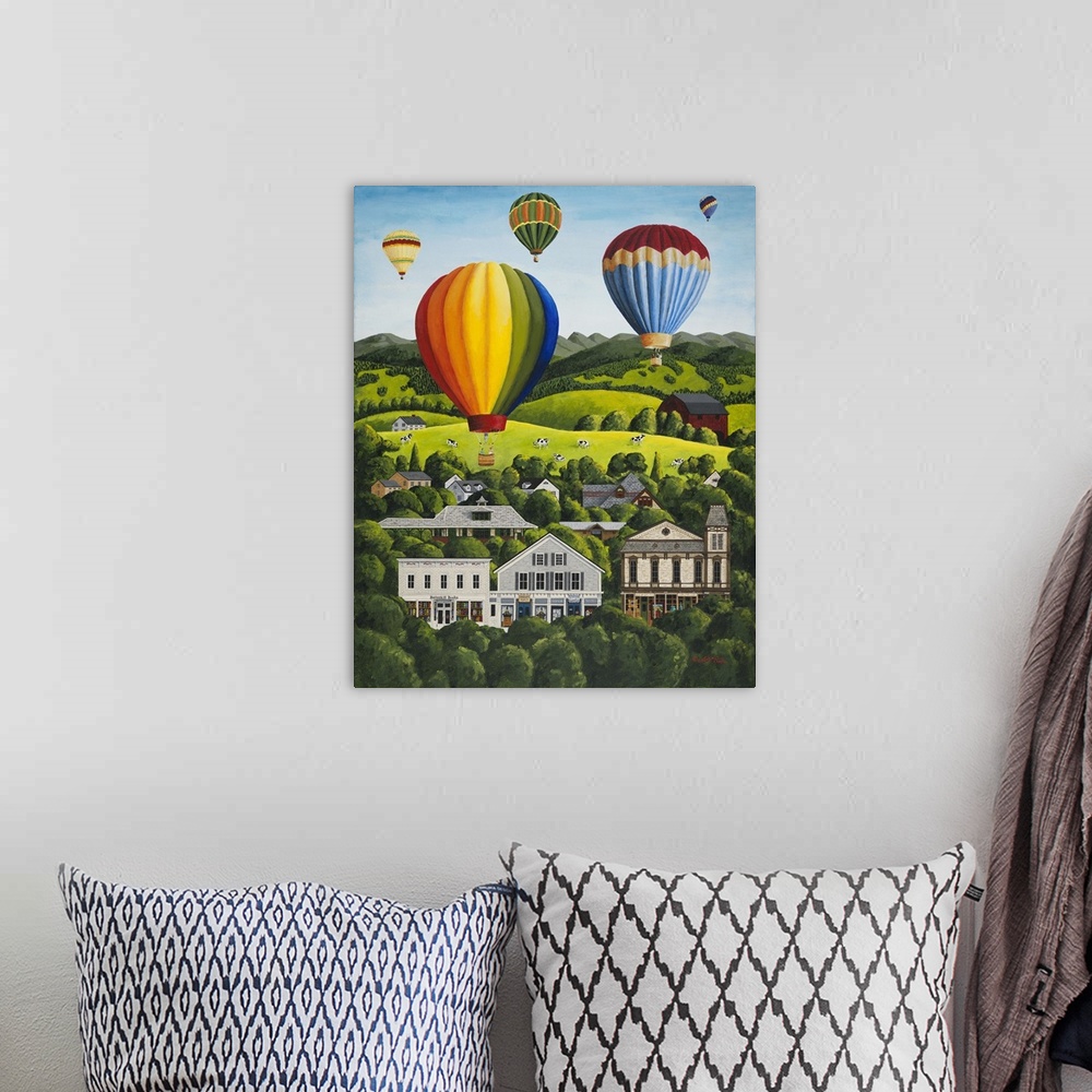 A bohemian room featuring Colorful hot air balloons floating above a hillside town.