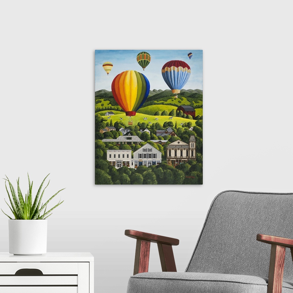 A modern room featuring Colorful hot air balloons floating above a hillside town.