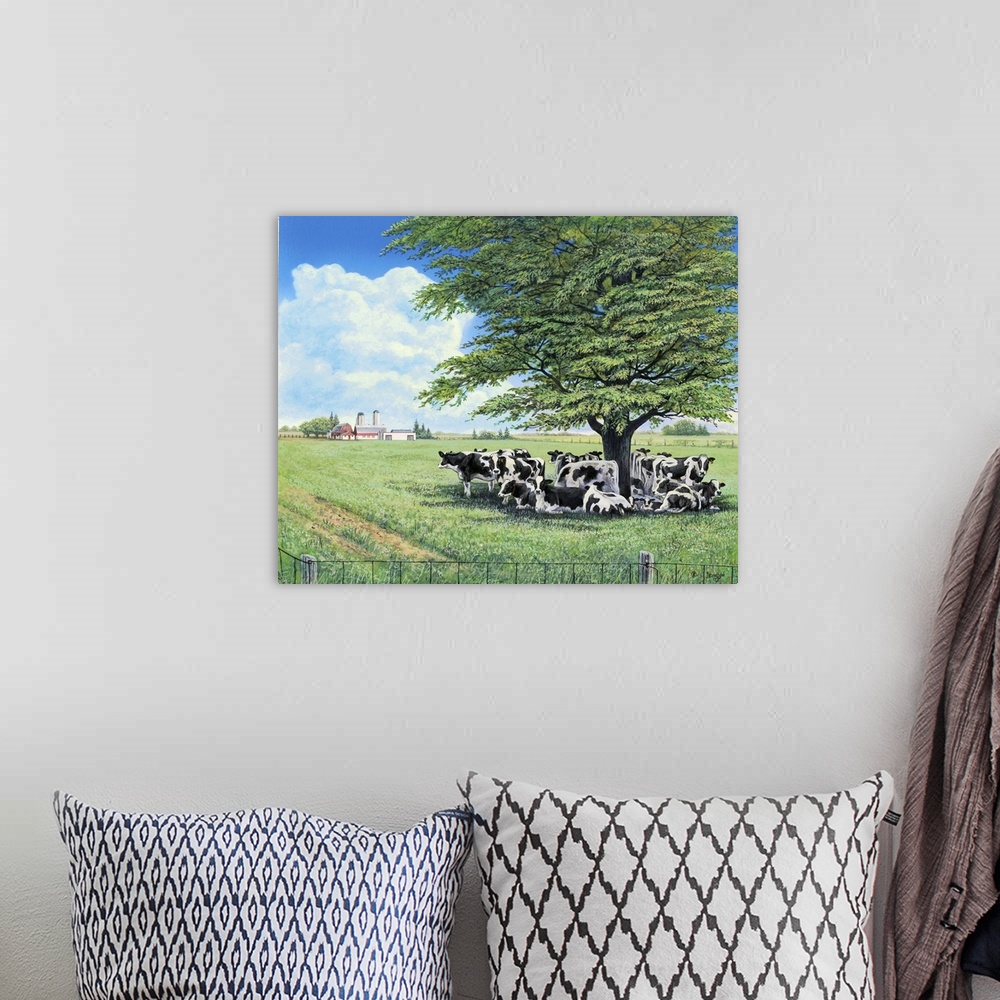 A bohemian room featuring Contemporary painting of a herd of cows under the shade of a lone tree in a field.