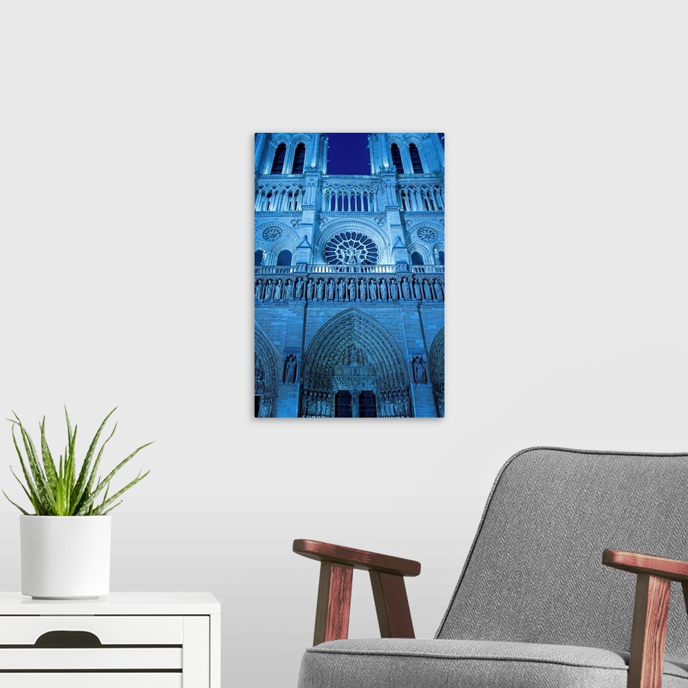 A modern room featuring Notre Dame Cathedral by Night