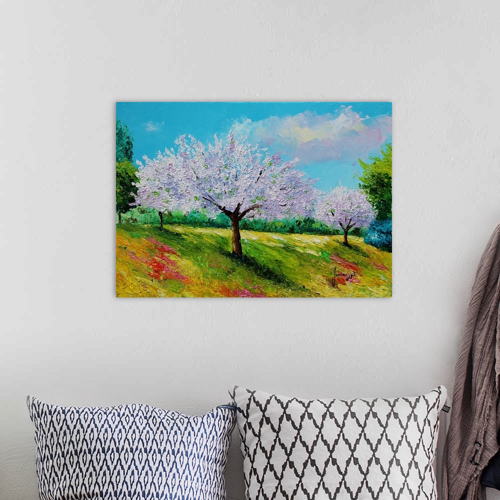 A bohemian room featuring Painting of a rural landscape of purple flowering trees.