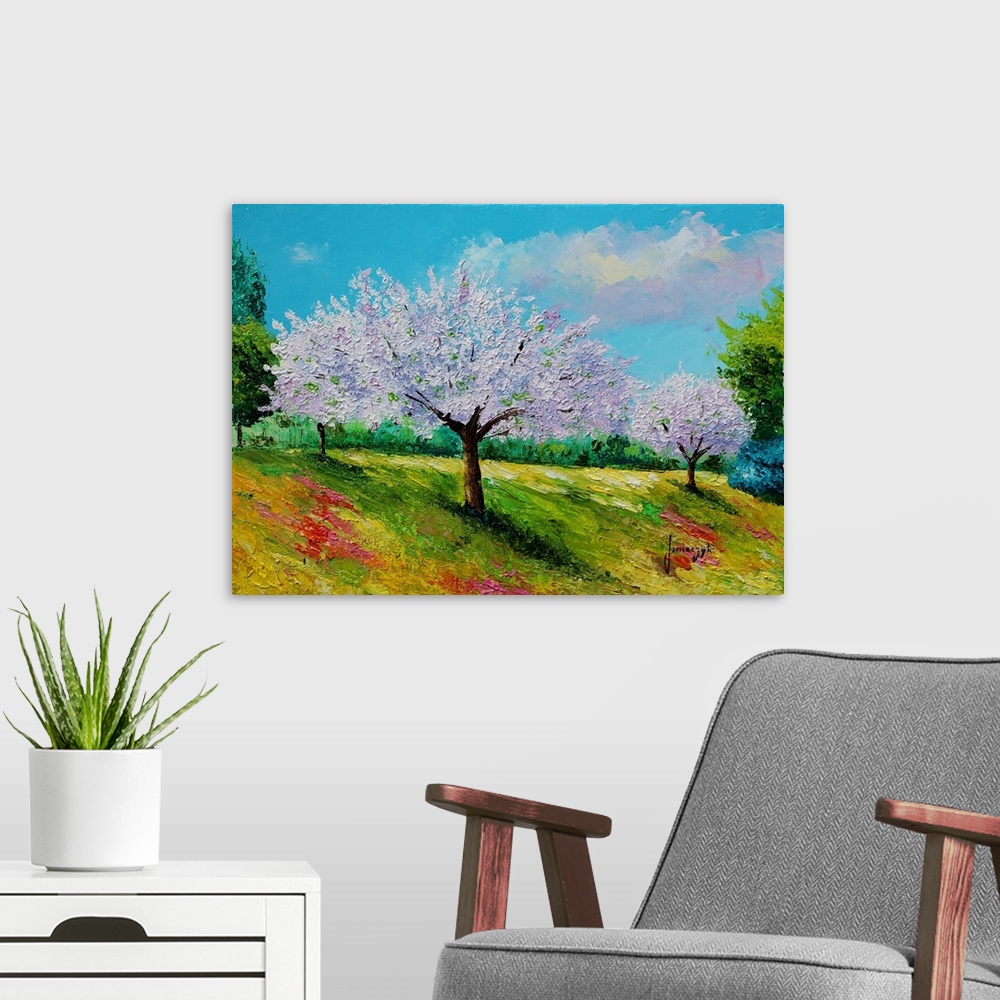 A modern room featuring Painting of a rural landscape of purple flowering trees.