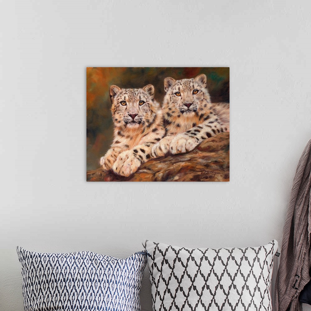 A bohemian room featuring Contemporary painting of a pair of snow leopards laying on a rock together.