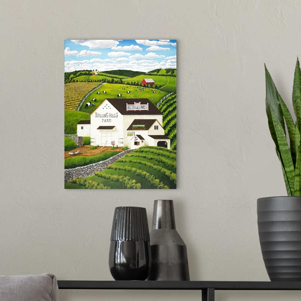 A modern room featuring Americana scene of a white barn with Belted Galloway cows.