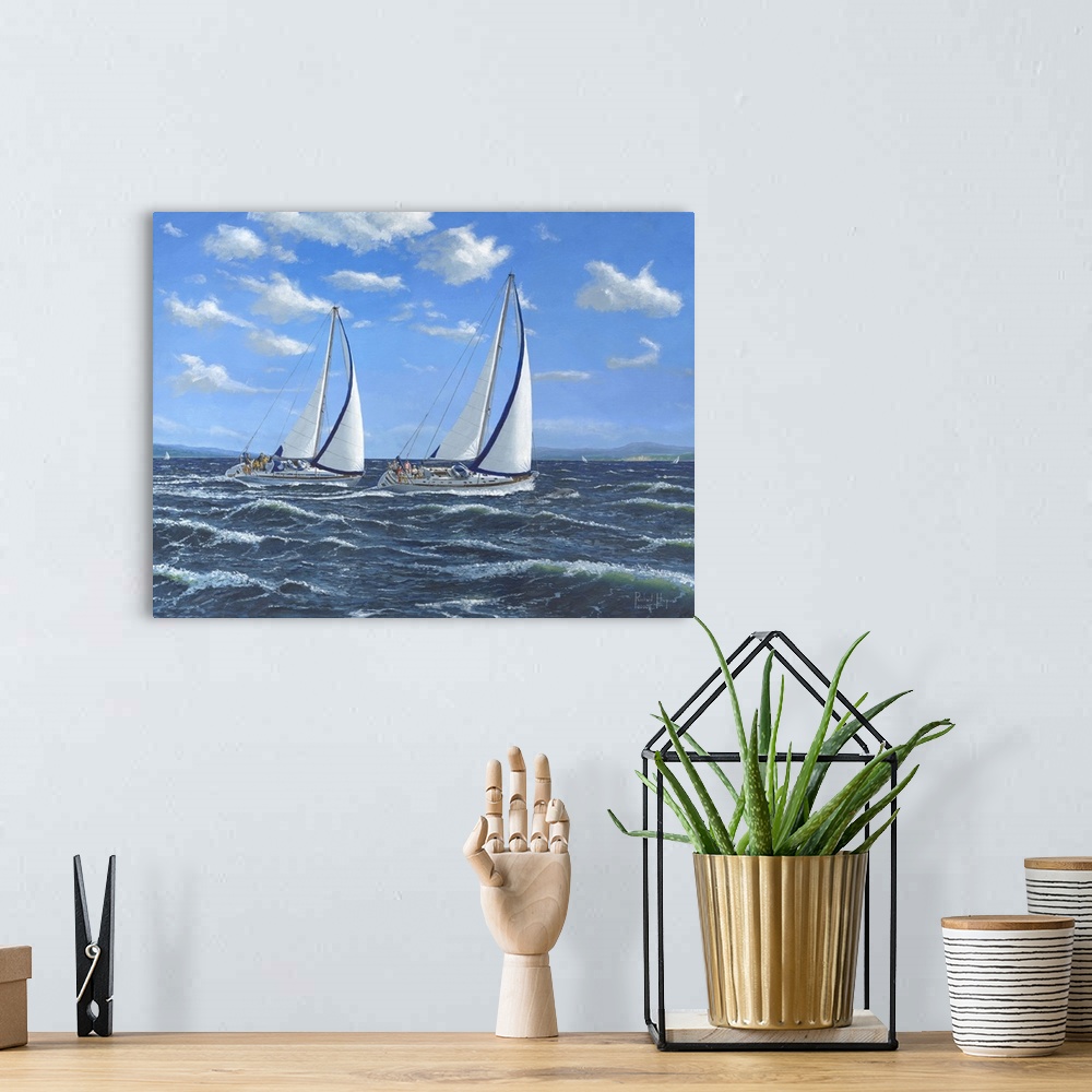 A bohemian room featuring Contemporary artwork of two sailboats on open seas.