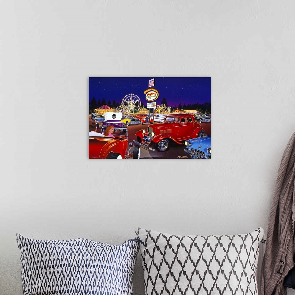 A bohemian room featuring Big painting of antique cars in the parking lot of an amusement park that is lit up in bright col...