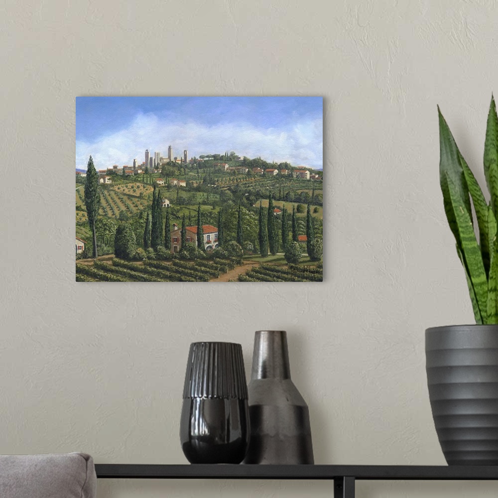 A modern room featuring Contemporary artwork of an European valley scattered with villages, home and vineyards.