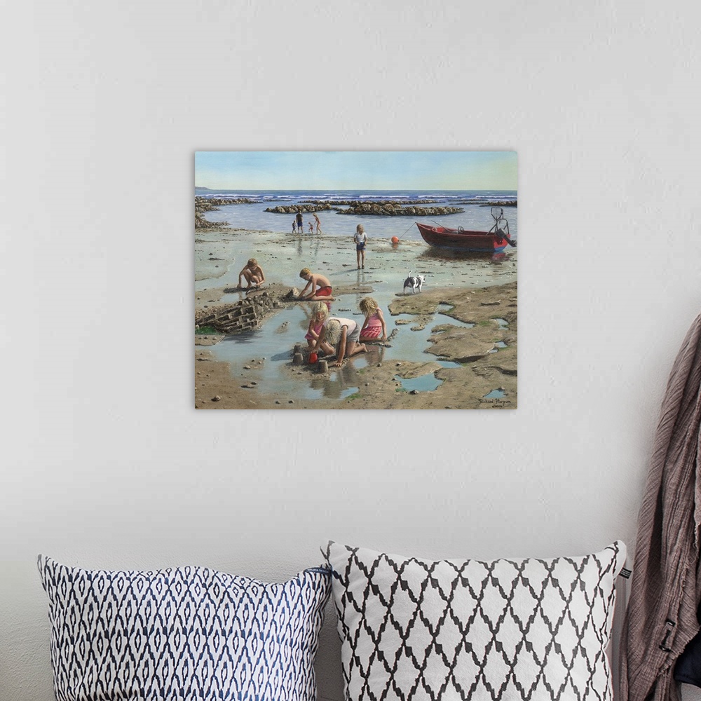 A bohemian room featuring Contemporary painting of children in the sand on a rugged looking beach.