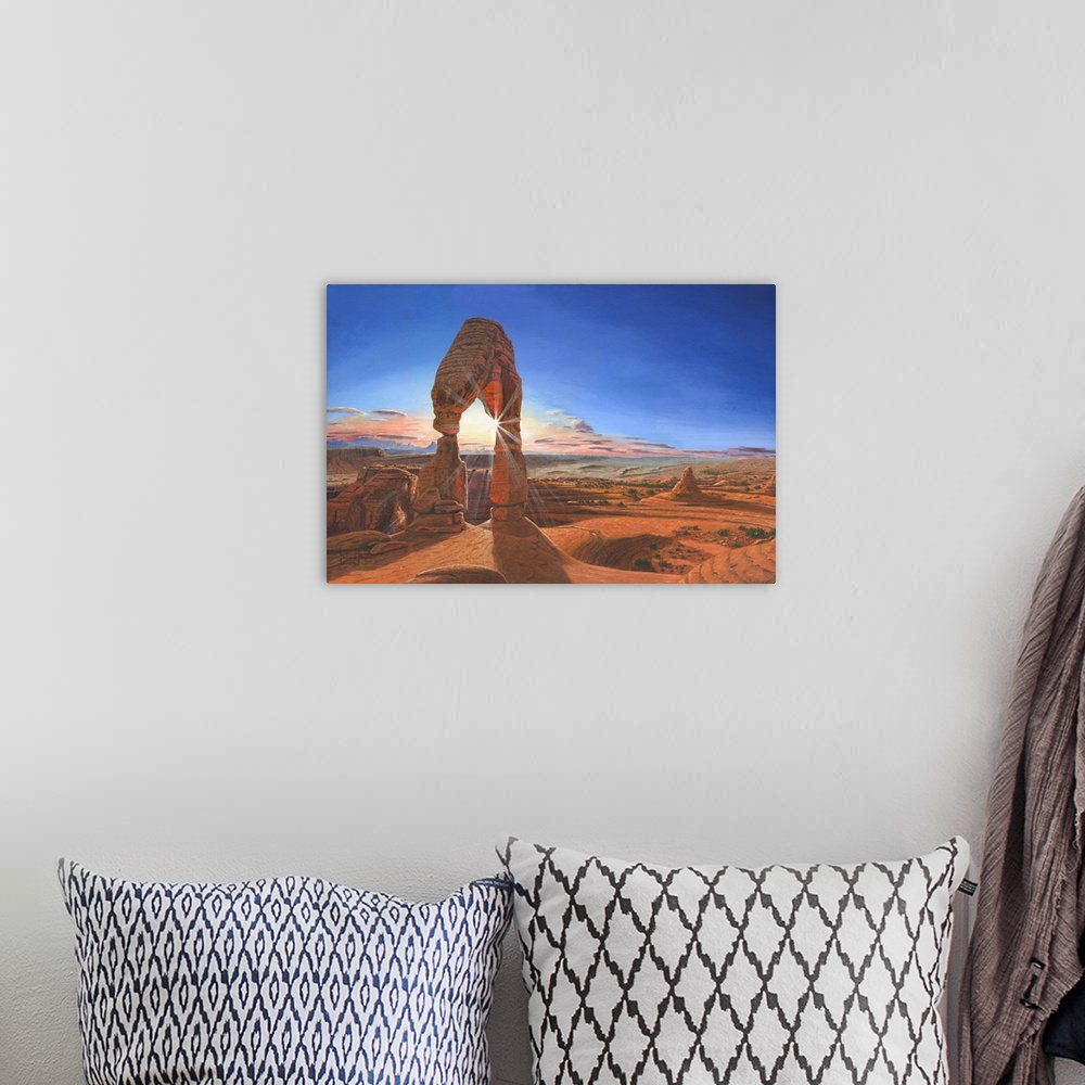 A bohemian room featuring Contemporary artwork of a delicate looking natural rock arch overlooking a desert vista.