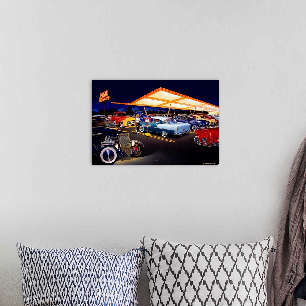 A bohemian room featuring Landscape, large wall art of an early 60s drive-in at night, with a car hop. Many classic cars ar...