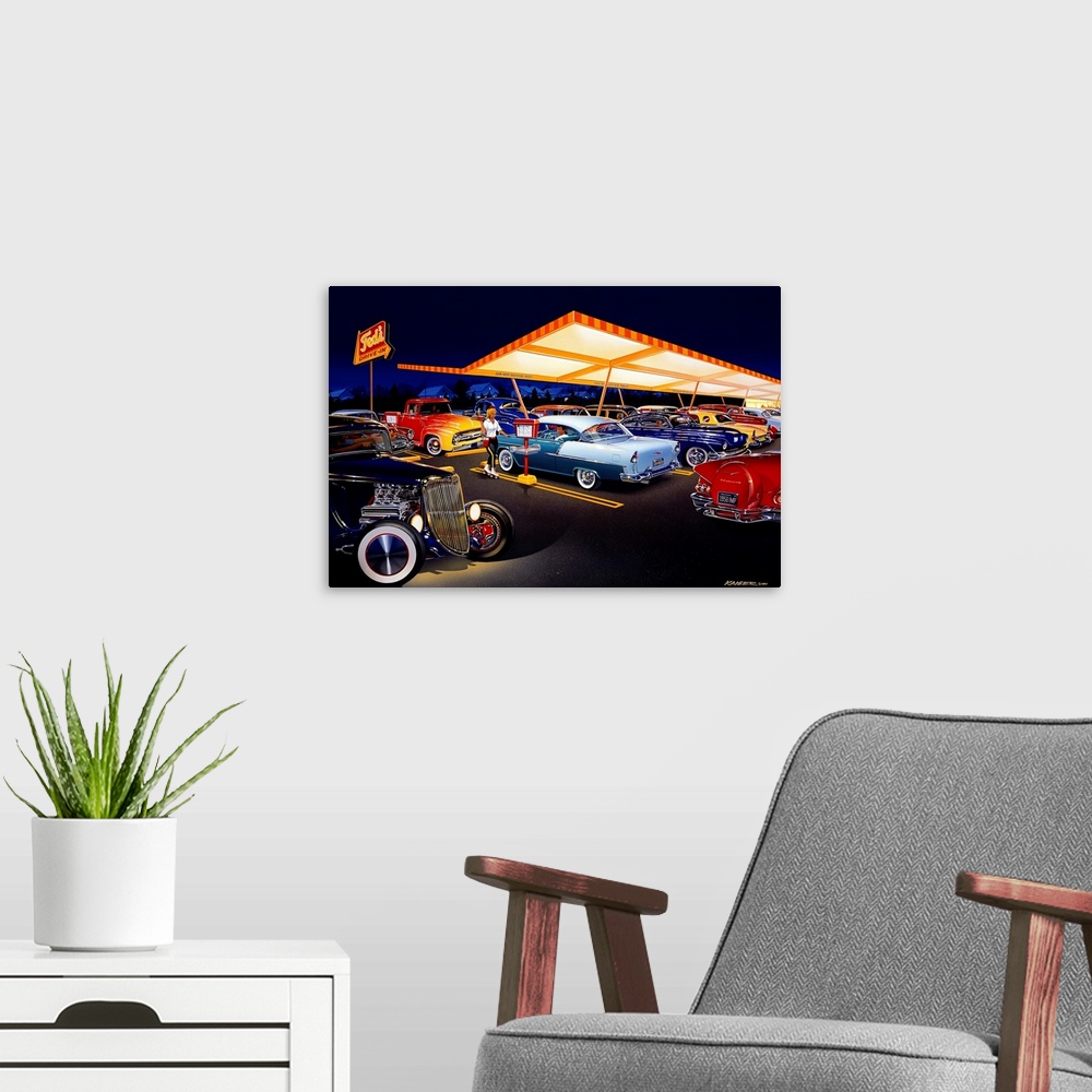 A modern room featuring Landscape, large wall art of an early 60s drive-in at night, with a car hop. Many classic cars ar...