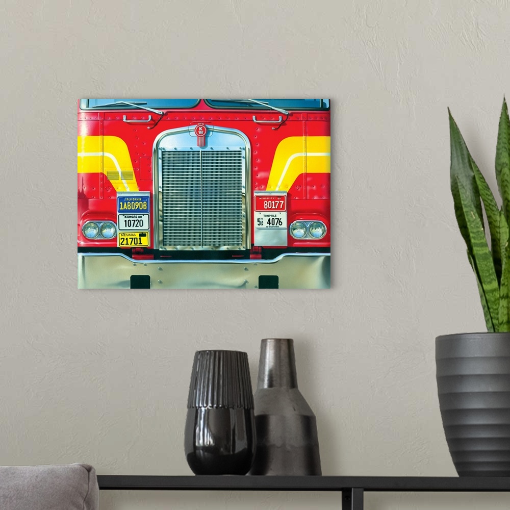 A modern room featuring Contemporary artwork of the front of a very large red truck with yellow stripes.