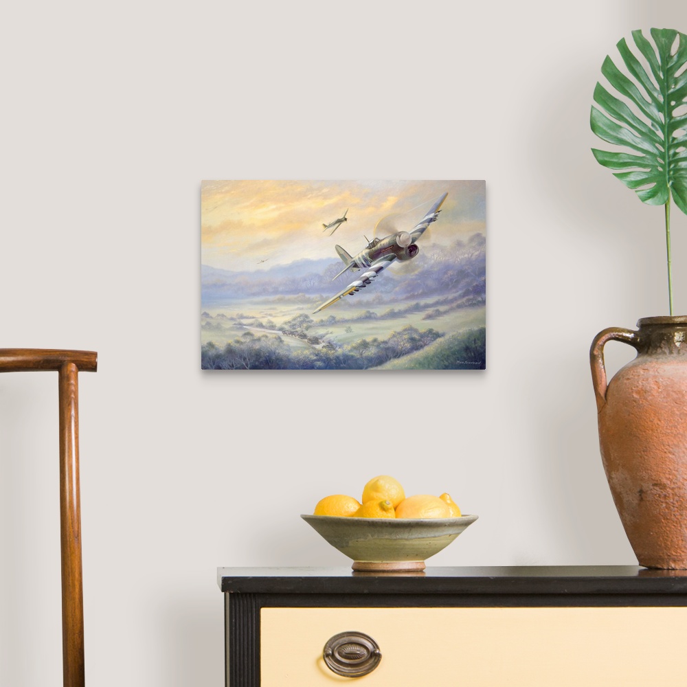 A traditional room featuring Contemporary artwork of military fighter planes flying over a rural landscape with tank caravan m...