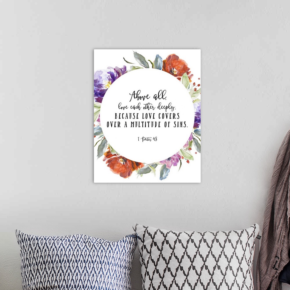A bohemian room featuring Bible verse typography art in handlettered text, framed by blooming watercolor flowers.