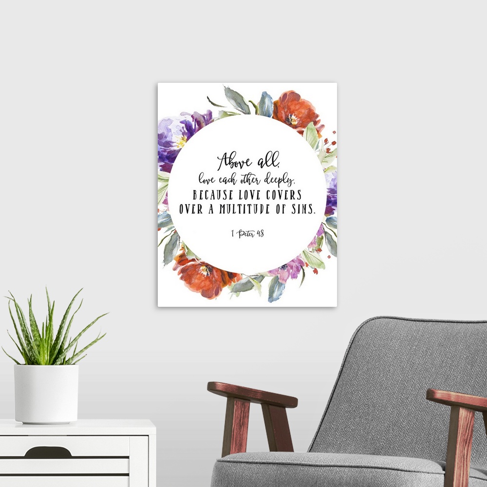 A modern room featuring Bible verse typography art in handlettered text, framed by blooming watercolor flowers.