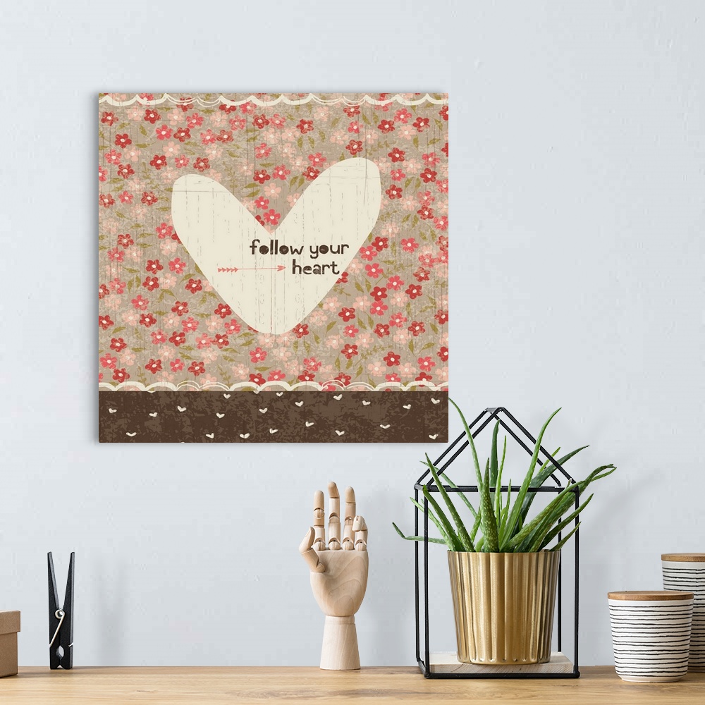 A bohemian room featuring Collage style romantic artwork with a floral print background and a cut out heart.
