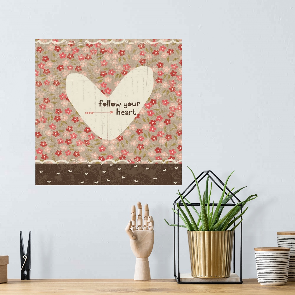 A bohemian room featuring Collage style romantic artwork with a floral print background and a cut out heart.