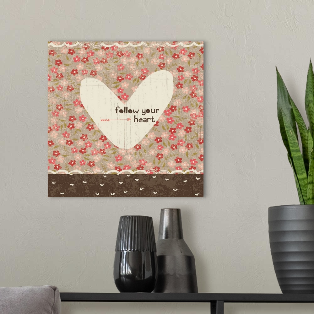 A modern room featuring Collage style romantic artwork with a floral print background and a cut out heart.