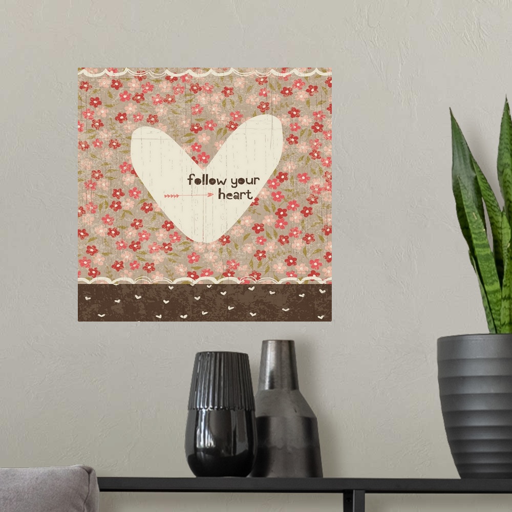 A modern room featuring Collage style romantic artwork with a floral print background and a cut out heart.