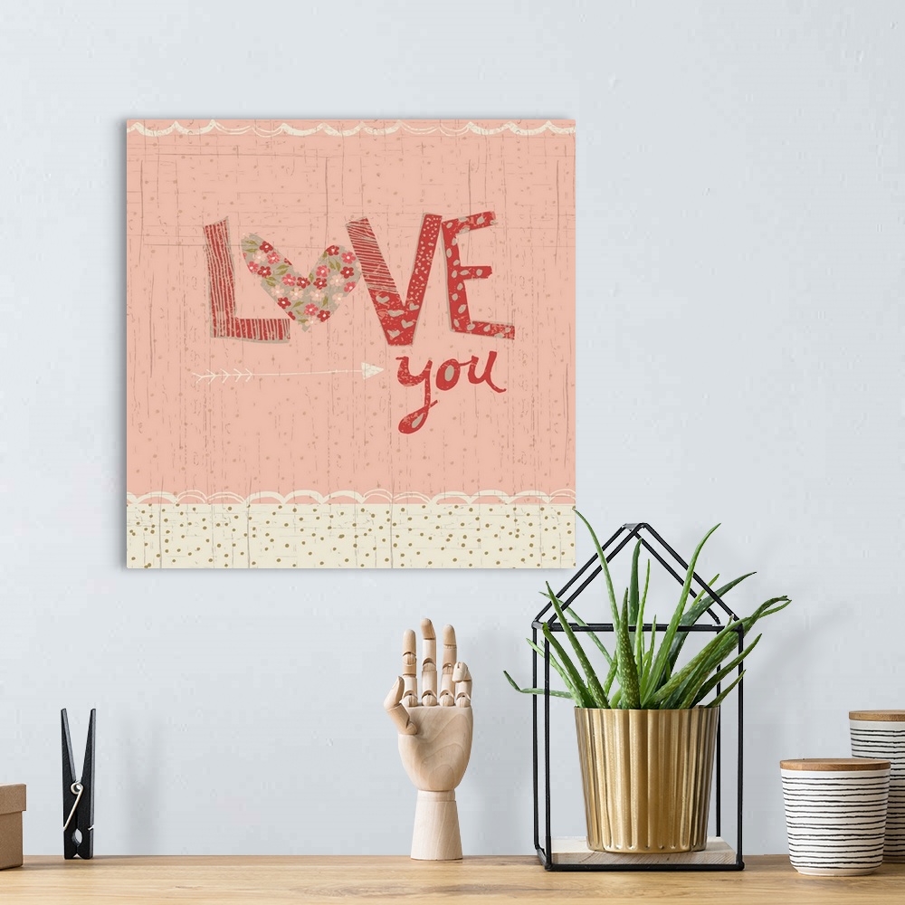 A bohemian room featuring Collage style romantic artwork with a floral print border reading "Love You."