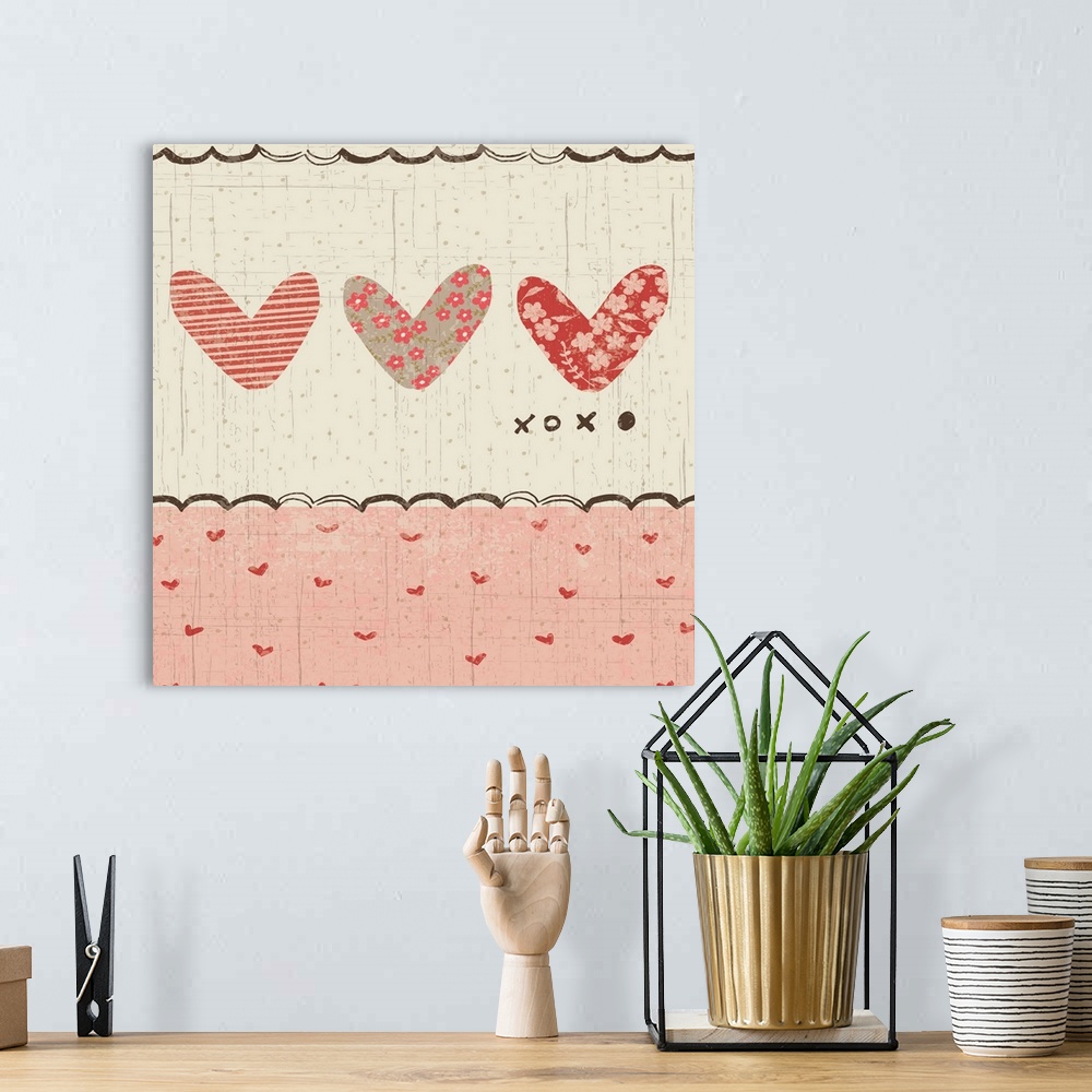 A bohemian room featuring Collage style romantic artwork with a heart print border with three cut-out hearts.