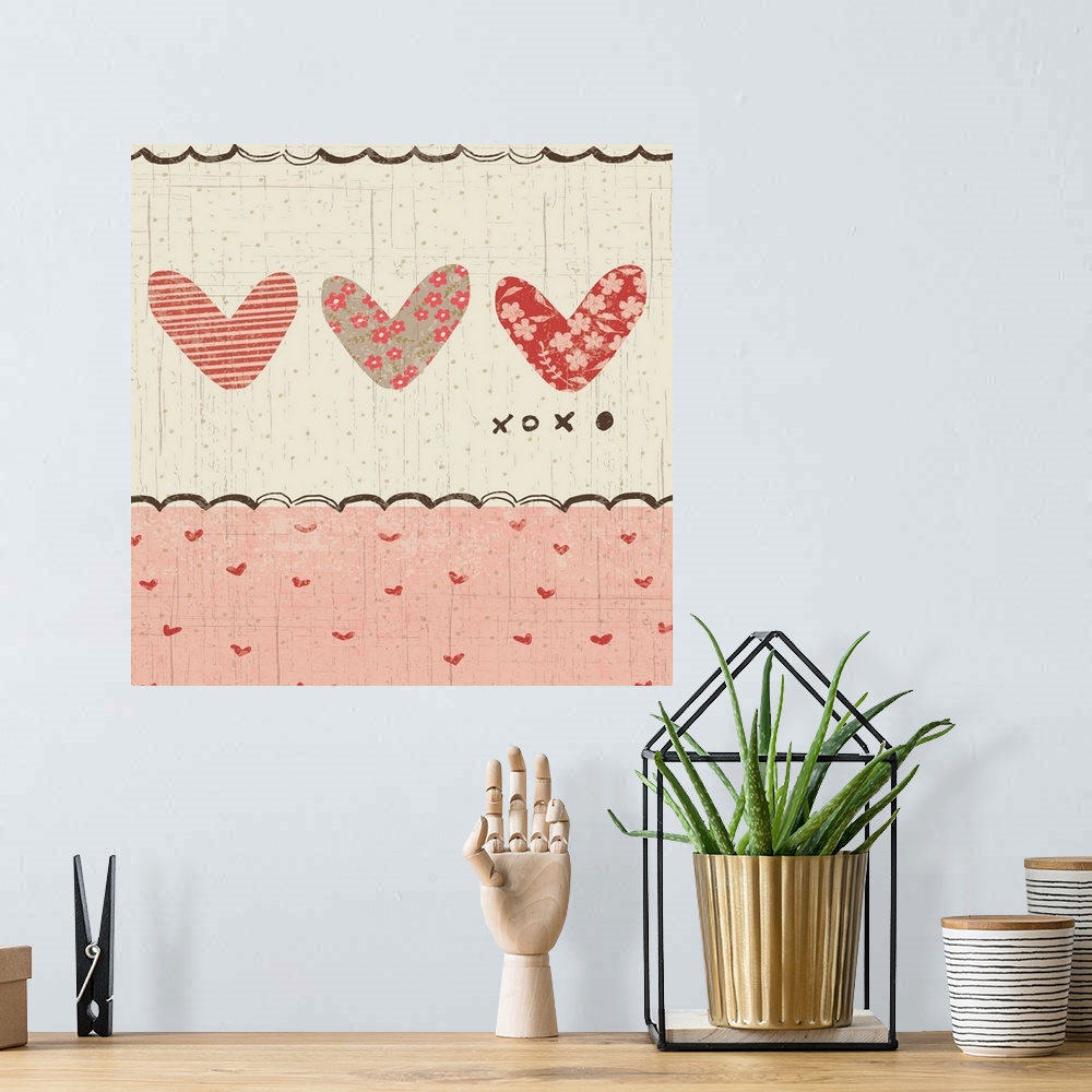 A bohemian room featuring Collage style romantic artwork with a heart print border with three cut-out hearts.