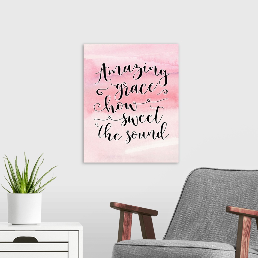 A modern room featuring "Amazing Grace How Sweet the Sound" on a pink watercolor background.