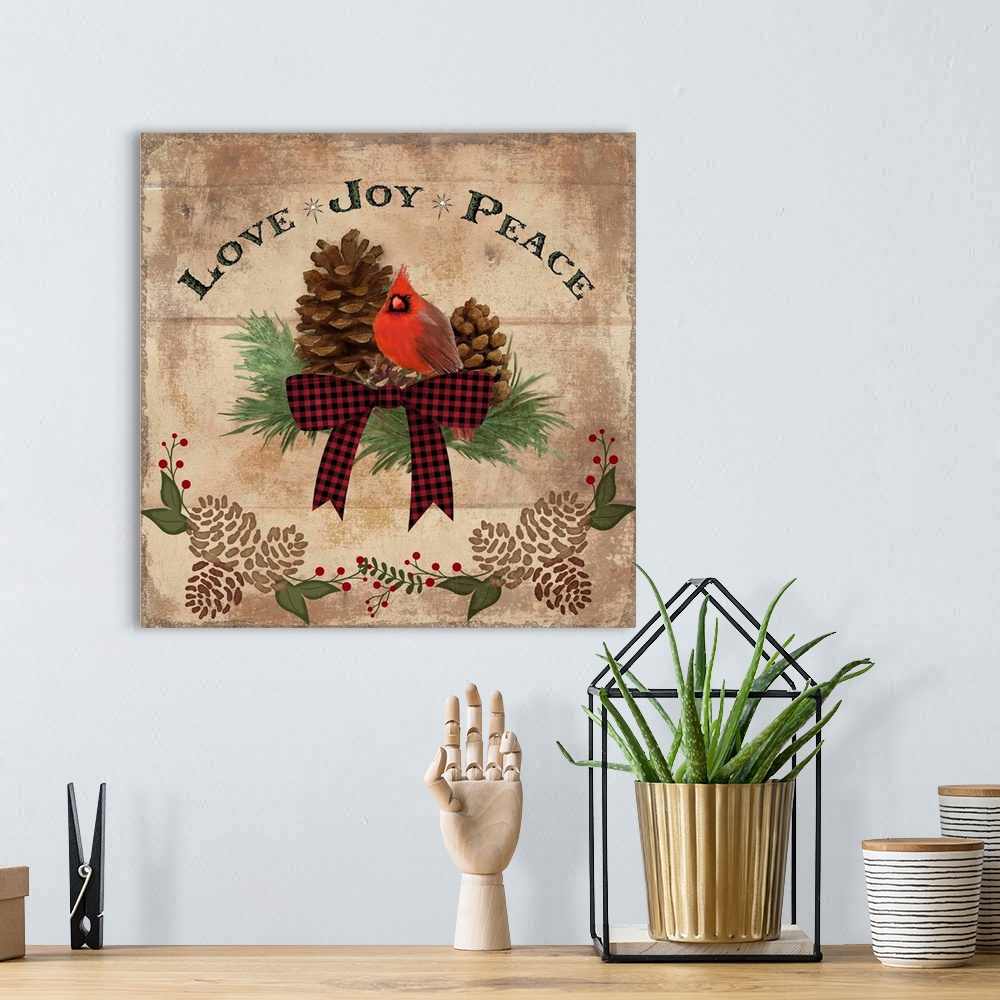 A bohemian room featuring Christmas decor of a cardinal with pinecones and a festive bow.